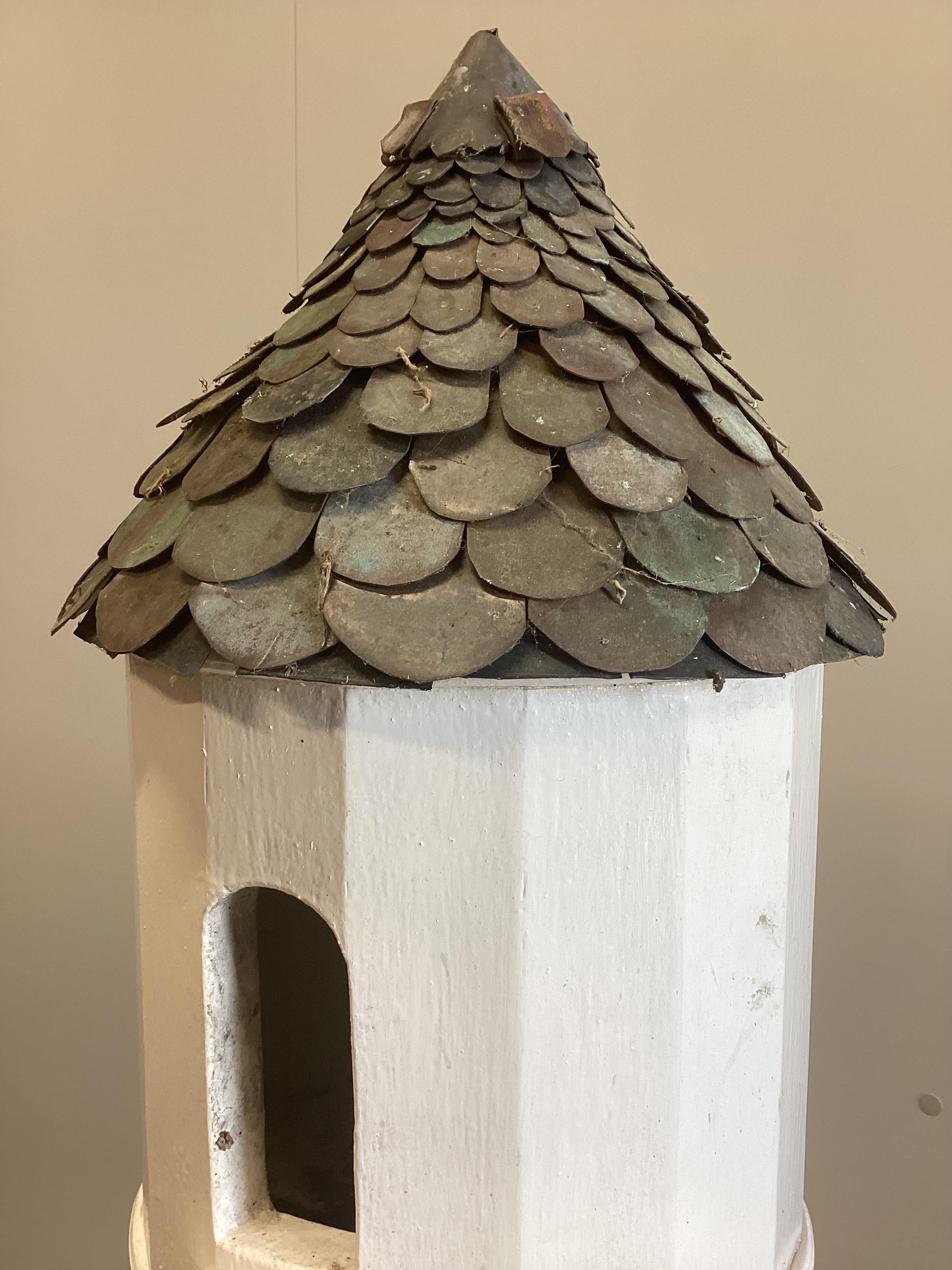 A painted wooden dovecote with scaled copper roof, height 190cm